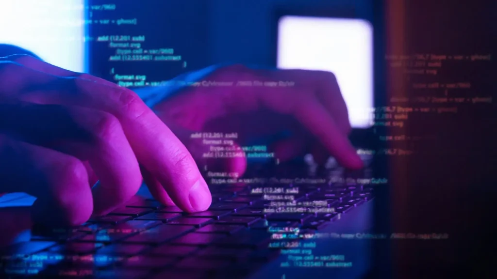 man typing on keyword code and search
