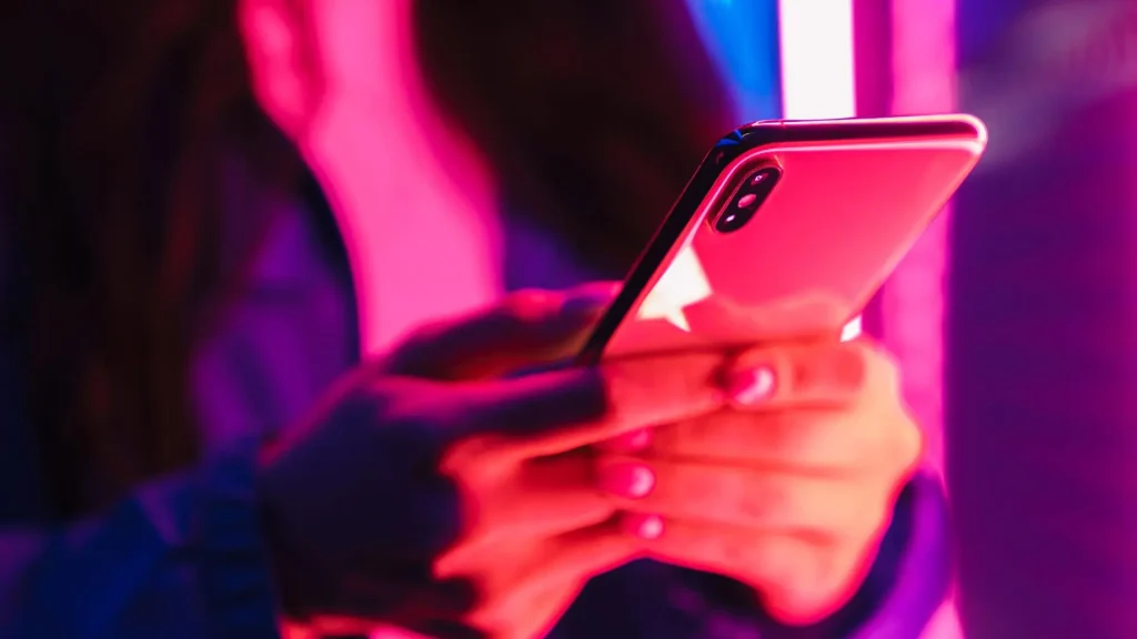 Women holding mobile phone and texting
